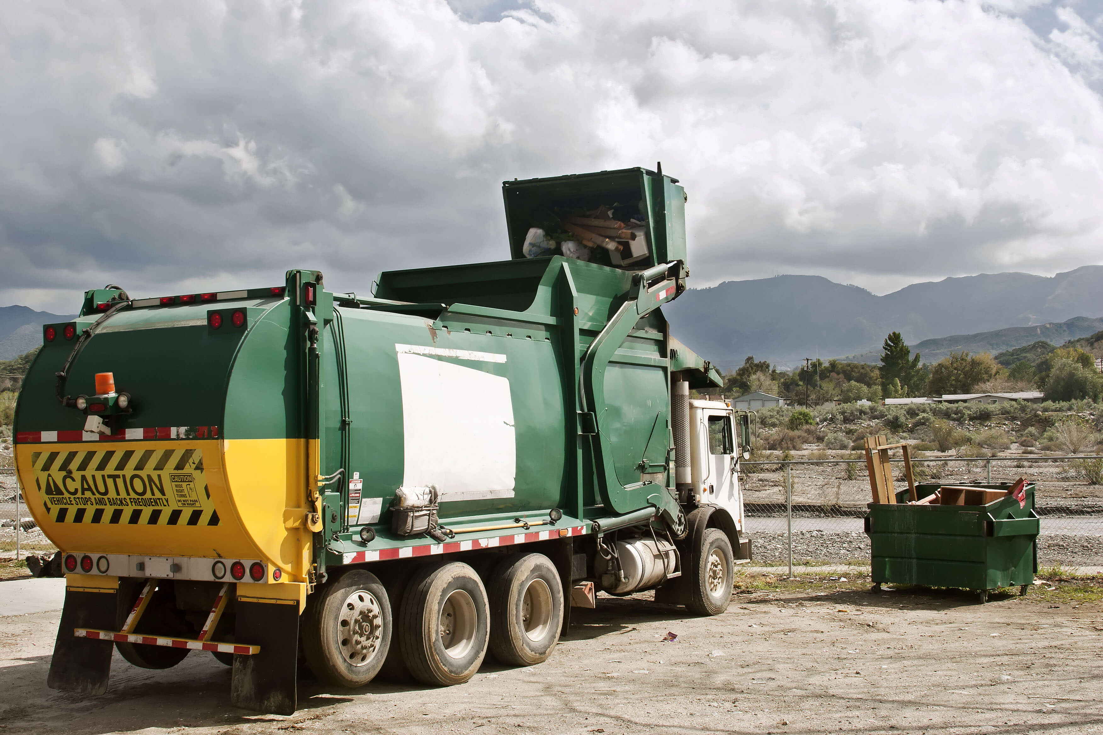 green garbage truck